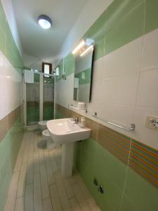 a bathroom with a sink and a toilet at Le Terrazze in Agropoli +36 photos