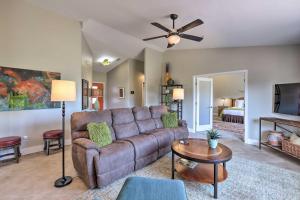 a living room with a couch and a ceiling fan at Stunning West Sedona Retreat Deck and Soaking Tubs! in Sedona