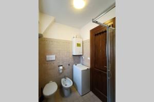 a bathroom with a toilet and a sink at Casa Vacanze Belvedere in Castel di Sangro