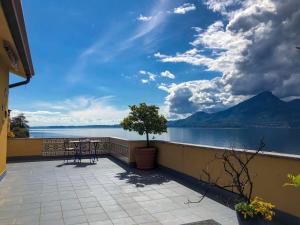 a balcony with a view of a lake and mountains at Casa Sardi in Brenzone sul Garda