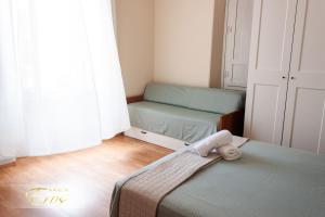Postel nebo postele na pokoji v ubytování Hotel Eros