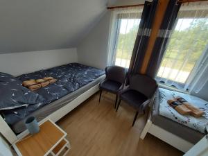 Posteľ alebo postele v izbe v ubytovaní Nowa Śluza