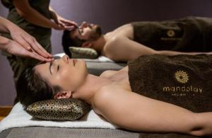 a woman getting a massage at a spa at PortoBay Liberdade in Lisbon