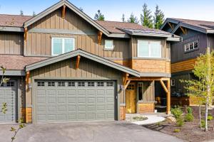 a house with two garage doors in front of it at Tranquility Trail at Suncadia Resort in Cle Elum