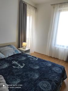 Postel nebo postele na pokoji v ubytování Galboka Nine