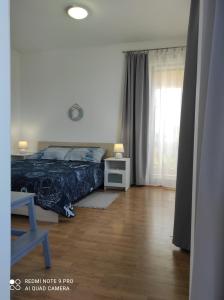 Postel nebo postele na pokoji v ubytování Galboka Nine