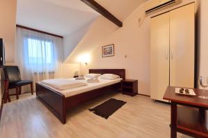 Postel nebo postele na pokoji v ubytování Apartments & Accommodation Stojic