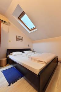 Postel nebo postele na pokoji v ubytování Apartments & Accommodation Stojic