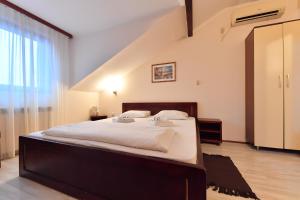 Postel nebo postele na pokoji v ubytování Apartments & Accommodation Stojic
