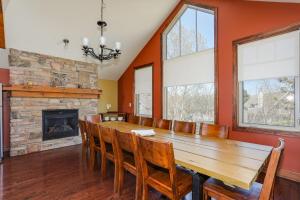 a dining room with a wooden table and a fireplace at Blue View 7 Luna Chalet 84150 in Blue Mountains