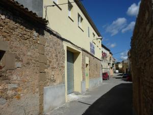 a building with a door on the side of a street at Apartments Bon Pas Rural in Claravalls