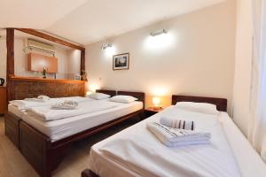Postel nebo postele na pokoji v ubytování Apartments & Accommodation Stojic