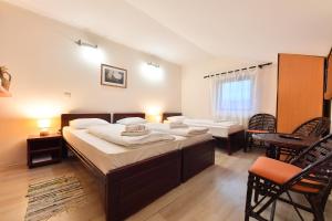 Postel nebo postele na pokoji v ubytování Apartments & Accommodation Stojic