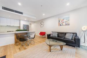 Area soggiorno di Docklands 2-Bed Near CBD & Marvel Stadium