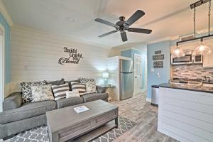 a living room with a couch and a kitchen at Pool and Direct Beach Access Corpus Christi Escape in Corpus Christi