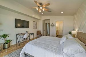 a bedroom with a bed and a ceiling fan at Modern Retreat with View, 9 Mi to Wahweap Beach! in Page