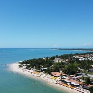 an aerial view of a beach with a group of people at Areia do Atlantico Hotel in Porto Seguro