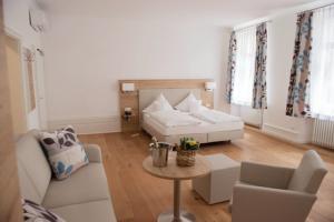 Postel nebo postele na pokoji v ubytování Hotel Perkeo