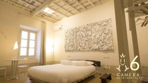 Postel nebo postele na pokoji v ubytování Guest House A Via dei Pellegrini