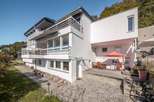 an aerial view of a white house with a patio at Designapartment Vitibuck in Waldshut-Tiengen