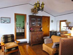 a living room with a couch and a table at Casa Emanuela 1 in Baiardo