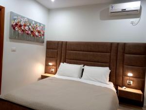 Postel nebo postele na pokoji v ubytování Hotel Relax Dhermi
