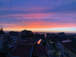 a view of a city at sunset at Al Sesto City Center in Capo dʼOrlando