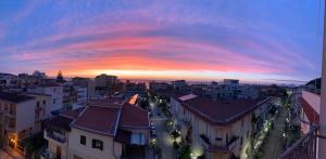 a view of a city at sunset at Al Sesto City Center in Capo dʼOrlando