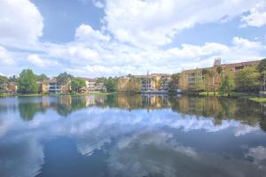 a large body of water with houses and buildings at Club Wyndham Cypress Palms in Kissimmee