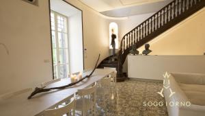Posezení v ubytování Guest House A Via dei Pellegrini + 34 fotografií