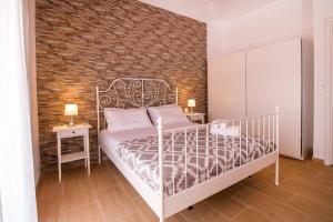 Posteľ alebo postele v izbe v ubytovaní Emerald Dream Apartment