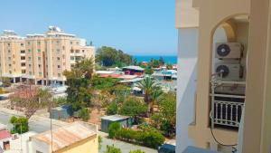 a view from a balcony of a city at Luxury Maisonette Apartment -SEA VIEW, NETFLIX, GYM- 5 Min from Beach in Larnaka