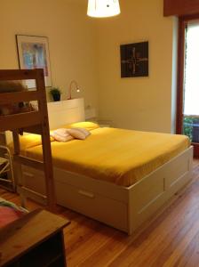 a bedroom with a bed and a ladder in it at B&B Le Ortensie -Lago di Como in Lierna