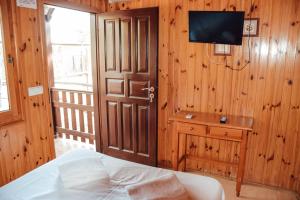 TV a/nebo společenská místnost v ubytování Camping La Aldea