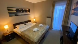 Postel nebo postele na pokoji v ubytování Willa Port Apartament + 30 fotografií