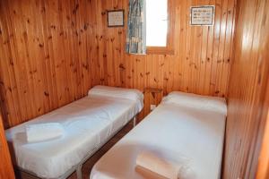 Postel nebo postele na pokoji v ubytování Camping La Aldea