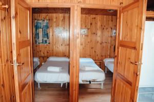 Postel nebo postele na pokoji v ubytování Camping La Aldea