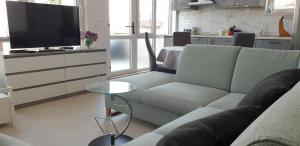 TV a/nebo společenská místnost v ubytování Villa Wind Apartments