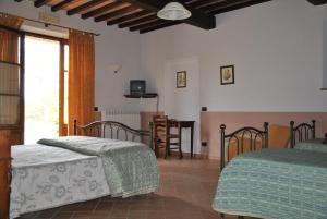 Posteľ alebo postele v izbe v ubytovaní Agriturismo Marinello