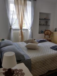 Кровать или кровати в номере VILLINO BRUNETTO azienda agrituristica