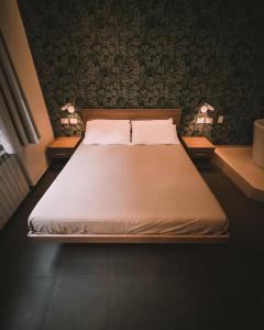 En eller flere senge i et værelse på Affittacamere Il Portico
