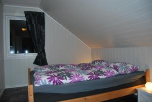 Postel nebo postele na pokoji v ubytování Eikeland Gard