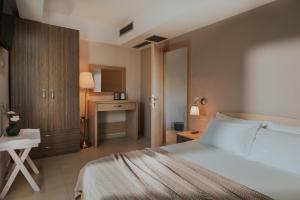 Ένα ή περισσότερα κρεβάτια σε δωμάτιο στο Kanali Homes