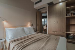Ένα ή περισσότερα κρεβάτια σε δωμάτιο στο Kanali Homes