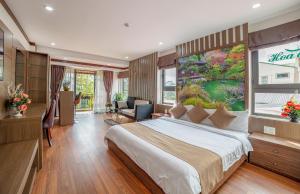 Postel nebo postele na pokoji v ubytování Khai Ngoc Hotel Da Lat City