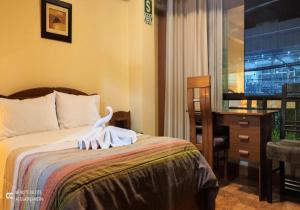 Postel nebo postele na pokoji v ubytování Hotel Don Sam