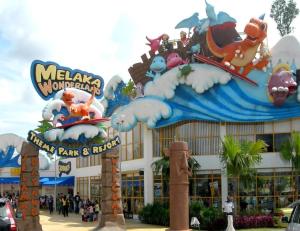 a disney world entrance with a large building at Sun Inns Hotel Ayer Keroh in Ayer Keroh