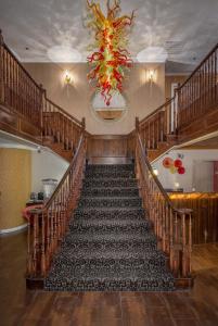 a staircase in a building with a chandelier at Canyons Boutique Hotel - A Canyons Collection Property in Kanab