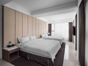 Ліжко або ліжка в номері Gamalan Spring Hotel