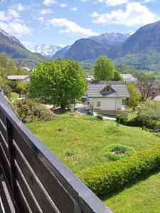 a view from a fence of a yard with a house at Monolocale Belvedere in Bovec